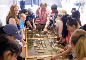 Program Instructor teaching middle school students at an exhibit at Smithsonian museum in Washington, DC