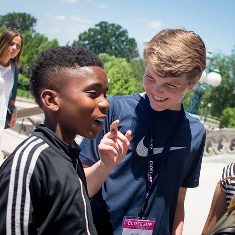 students talking outside