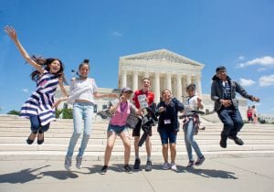 Middle school students jumping in front of Thomas Jefferson Memorial in Washington, DC